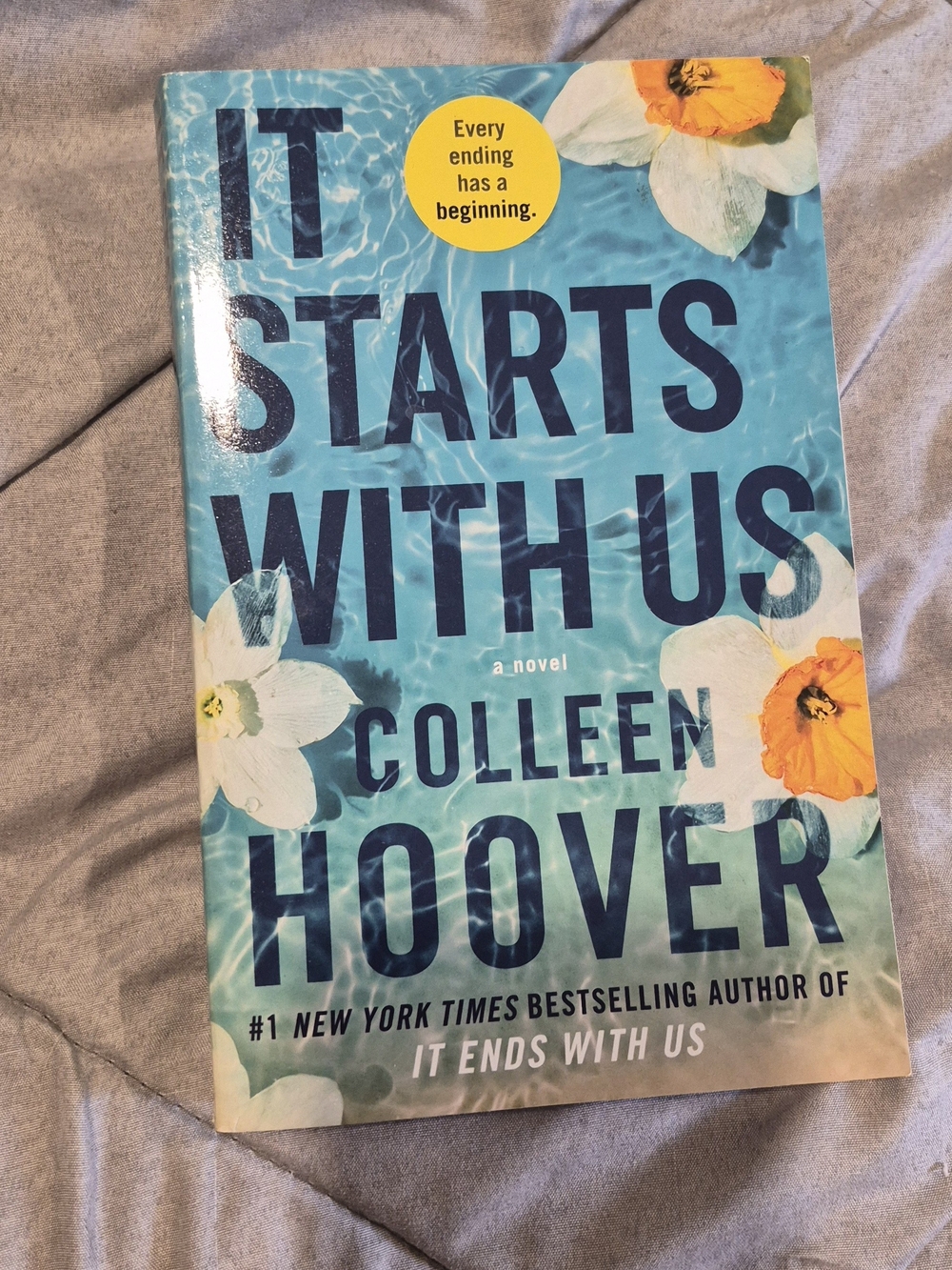 "It Starts With Us" Paperback Novel - Blue Cover